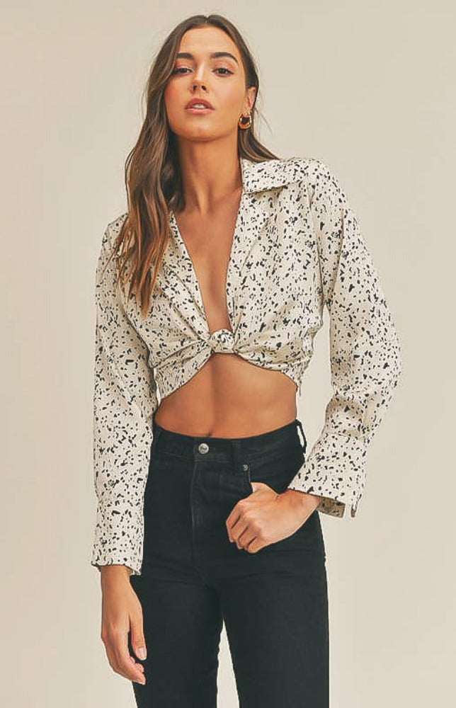 Dinner, drinks, and maybe a little dancing, we are here for all of it, especially while wearing the Aaliyah Satin Twist-Front Crop Top in cream and black! Textured satin shapes this top that has a plunging collared neckline and long sleeves with slit cuffs that create a flared effect. The cropped bodice has a twist-front accent at the front and back. Hidden side zipper.