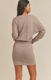 We can't count how many compliments you'll get when you rock the Scarlett Long Sleeve Mini Dress in Blush! This cute and cozy mini dress has a loose knit construction that shapes a V-neckline and long balloon sleeves that have drop shoulders and fitted cuffs. A figure-flattering silhouette ends at a contrasting knit skirt with a flirty mini hem. The elasticized waist will pull the eye to your accentuated the waistline.
