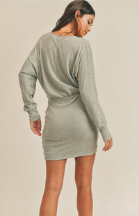 We can't count how many compliments you'll get when you rock the Scarlett Long Sleeve Mini Dress in sage! This cute and cozy mini dress has a loose knit construction that shapes a V-neckline and long balloon sleeves that have drop shoulders and fitted cuffs. A figure-flattering silhouette ends at a contrasting knit skirt with a flirty mini hem. The elasticized waist will pull the eye to your accentuated the waistline.