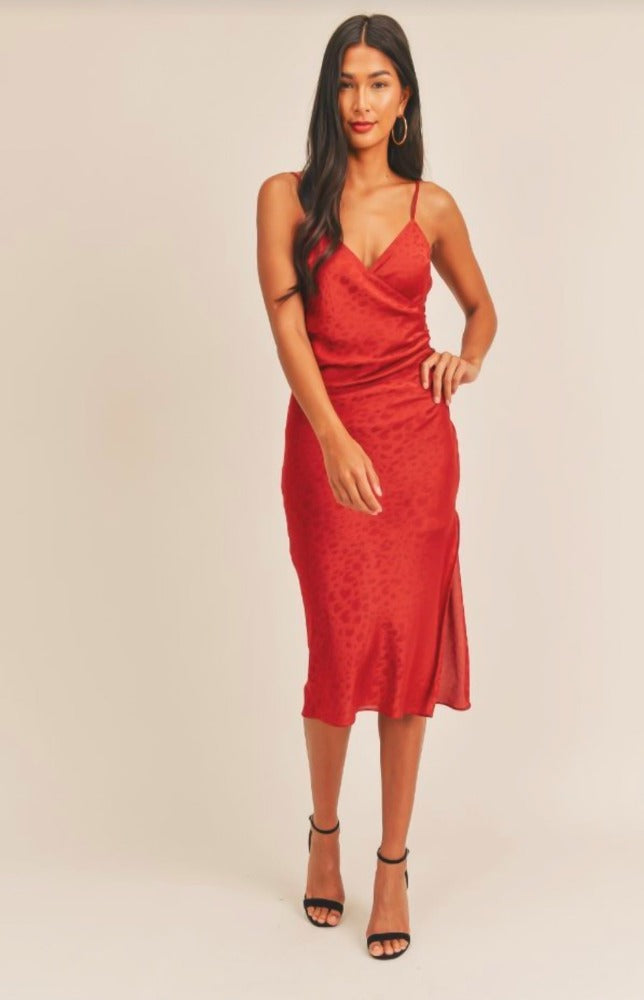 Give them something to talk about in the Brielle Shirred Side Slit Midi Dress! She is sleek and sexy and features a wrapped bodice with a subtle ruching side detail that leads into an eye-catching thigh high slit. Brielle is made of figure flattering satin fabric that will highlight your jaw-dropping silhouette. Adjustable shoulder straps allow you to tailor her fit to your liking.