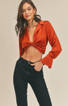 Dinner, drinks, and maybe a little dancing, we are here for all of it, especially while wearing the Aaliyah Satin Twist-Front Crop Top in spice! Textured satin shapes this top that has a plunging collared neckline and long sleeves with slit cuffs that create a flared effect. The cropped bodice has a twist-front accent at the front and back. Hidden side zipper.