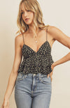 The Delilah floral flared top wants you to blossom into a field of happiness! Stretchy  fabric, with a ditsy pink, cream, and green floral print, shapes this cute crop top that has adjustable elasticized shoulder straps, a cropped ruffled bodice, and a triangle bust neckline. Pair with boots and leather jacket to add an edgy vibe!