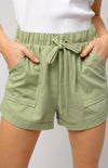 Everything will be going your way when you're wearing the Blakely Shorts! These perfect everyday shorts are shaped from lightweight woven fabric that sweeps from the elastic waist. Light and breezy fabric construct these relaxed shorts in a gorgeous light olive hue. High, elasticized waist is accented with drawstring ties and deep front pockets. 