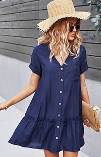 The Sophia Navy Blue Button-Up Mini Dress is what daydreams are made of! Light and breezy fabric creates this perfect sundress with cuffed arm sleeves, a V-neckline, and a cute ruffled hem. Delicate buttons add a darling detail as they travel down the front to an A-line mini skirt with a high, loose waist and seamed, ruffle hem.