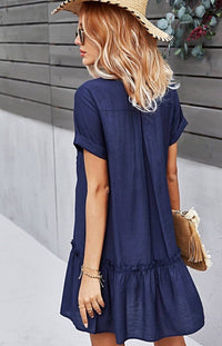 The Sophia Navy Blue Button-Up Mini Dress is what daydreams are made of! Light and breezy fabric creates this perfect sundress with cuffed arm sleeves, a V-neckline, and a cute ruffled hem. Delicate buttons add a darling detail as they travel down the front to an A-line mini skirt with a high, loose waist and seamed, ruffle hem.