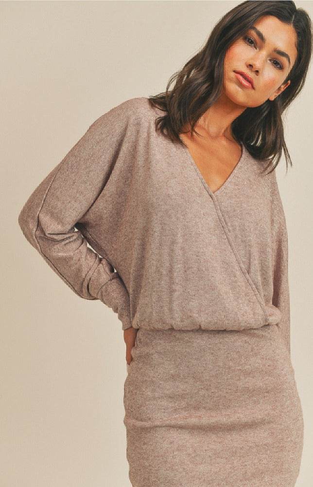 We can't count how many compliments you'll get when you rock the Scarlett Long Sleeve Mini Dress in Blush! This cute and cozy mini dress has a loose knit construction that shapes a V-neckline and long balloon sleeves that have drop shoulders and fitted cuffs. A figure-flattering silhouette ends at a contrasting knit skirt with a flirty mini hem. The elasticized waist will pull the eye to your accentuated the waistline.