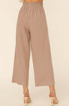 We are head over heels in love with the Katrina Woven Pinstripe Belted Paper Bag Wide Leg Pants. These cuties come with an ivory pinstripe detailed down to the ankle. The tie ribbon belt creates a paper bag waist. Dress these beauties up with heals and a blouse or down with a fitted bodysuit and flats.