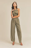 Take it easy in the Remi Halter Crop Top and Palazzo Pants Set in Olive! Woven fabric shapes this sleek and casual set that includes a ruched-detail crop top with a halter neckline, and lace-up back. Matching high-waisted Palazzo pants have wide, tulip pant legs and side pockets.