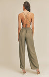 Take it easy in the Remi Halter Crop Top and Palazzo Pants Set in Olive! Woven fabric shapes this sleek and casual set that includes a ruched-detail crop top with a halter neckline, and lace-up back. Matching high-waisted Palazzo pants have wide, tulip pant legs and side pockets.